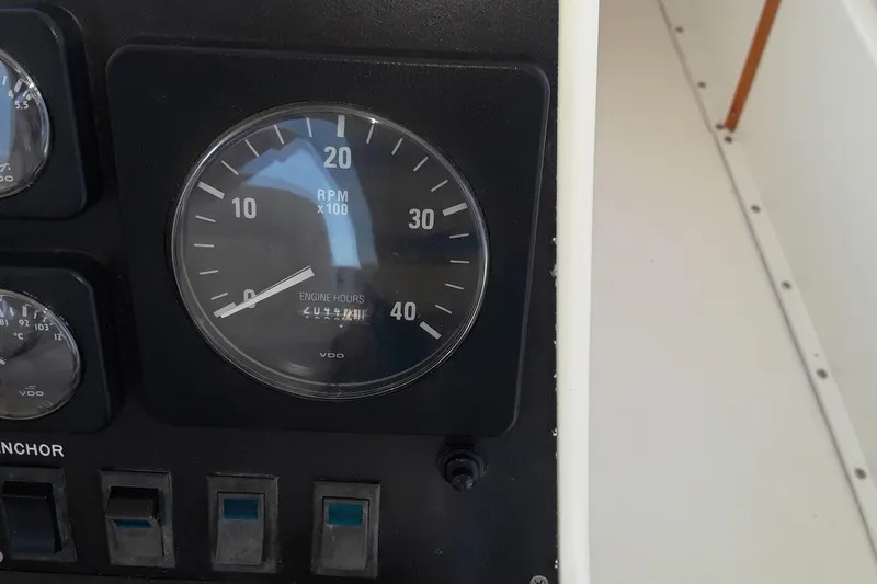 Slide: The Image of RPM gauge and switches on a 1987 Blackfin 36 Convertible boat. - 21
