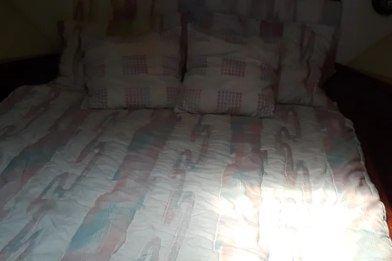 Slide: The Image of Bed in the cabin of a 1987 Blackfin 36 Convertible boat. - 25