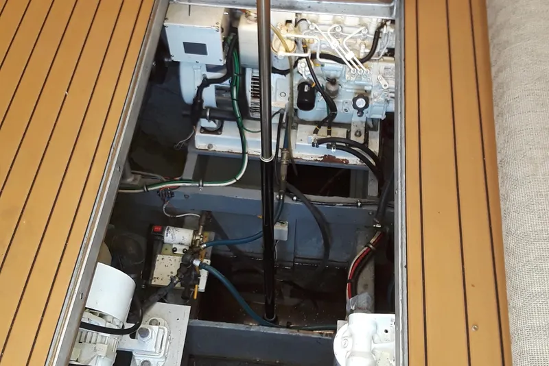 Slide: The Image of Engine compartment of a 1987 Blackfin 36 Convertible boat with visible machinery. - 34