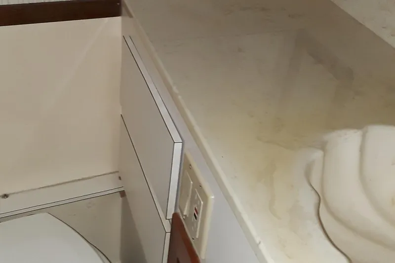 Slide: The Image of 1987 Blackfin 36 Convertible boat bathroom with sink and toilet. - 38