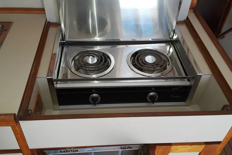 Slide: The Image of Electric stove in the kitchen of a 1987 Blackfin 36 Convertible boat. - 46