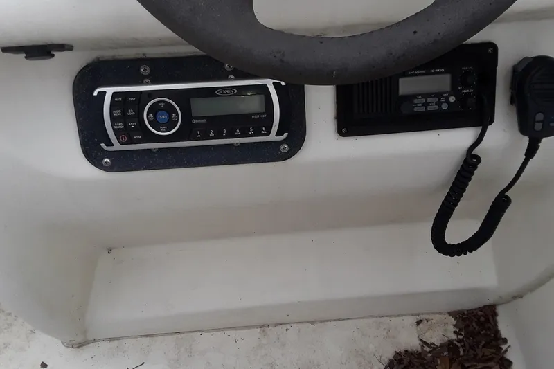Slide: The Image of Boat dashboard of a 1987 Blackfin 36 Convertible with radio and communication equipment. - 48