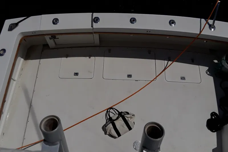 Slide: The Image of 1987 Blackfin 36 Convertible boat deck with storage compartments and a bag. - 8