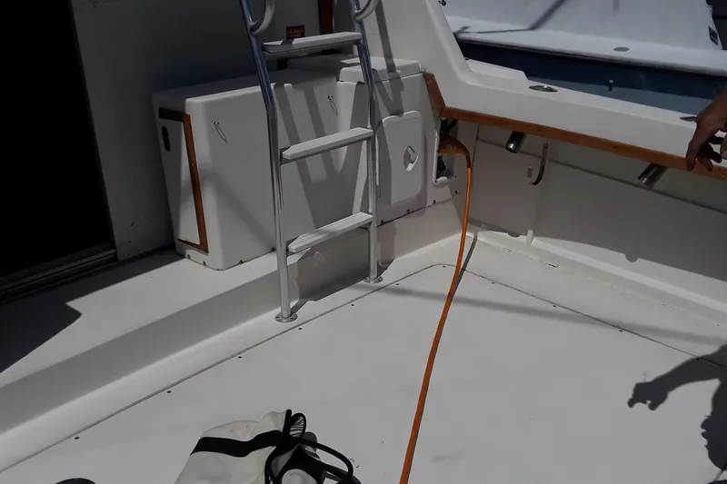 Slide: The Image of 1987 Blackfin 36 Convertible boat deck with ladder and storage compartments. - 9