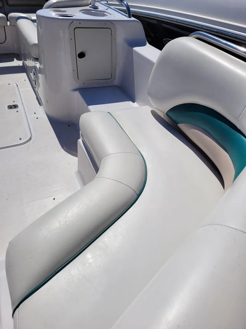 Slide: The Image of Interior seating and storage area of a 2000 Hurricane Fun Deck 201IO boat. - 15