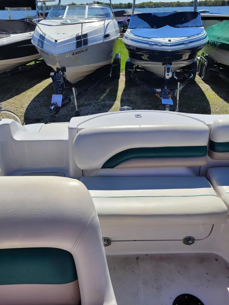 Slide: The Image of Interior view of a 2000 Hurricane Fun Deck 201IO boat with other boats in the background. - 18