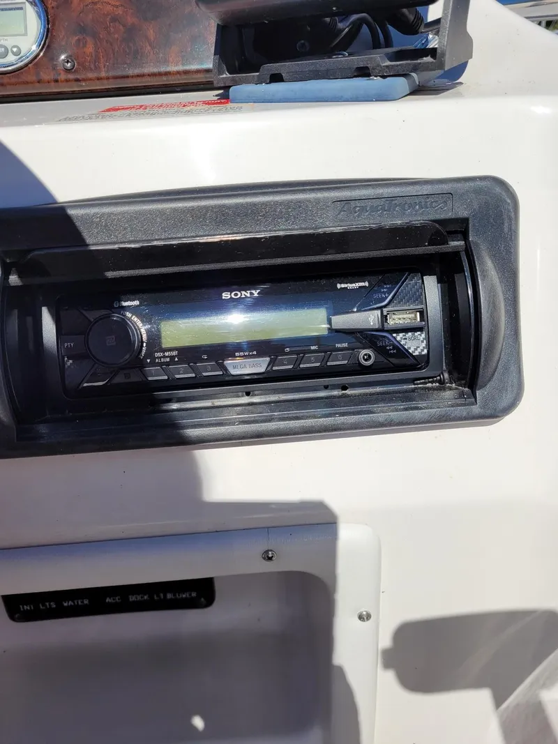 Slide: The Image of Sony stereo system on a 2000 Hurricane Fun Deck 201IO boat dashboard. - 6