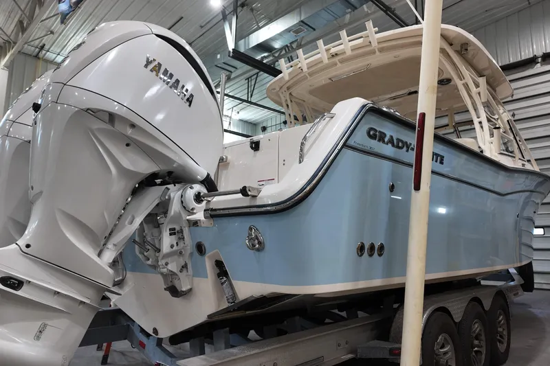 The Image of 2024 Grady-White Freedom 307 boat on trailer outside marine service center. - 0