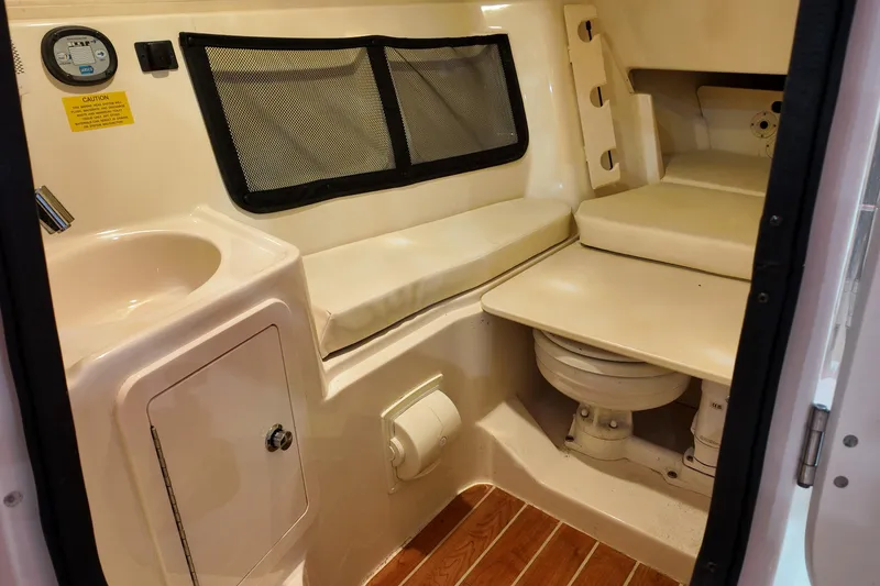 Slide: The Image of 2024 Grady-White Freedom 307 helm with advanced navigation and control systems. - 14