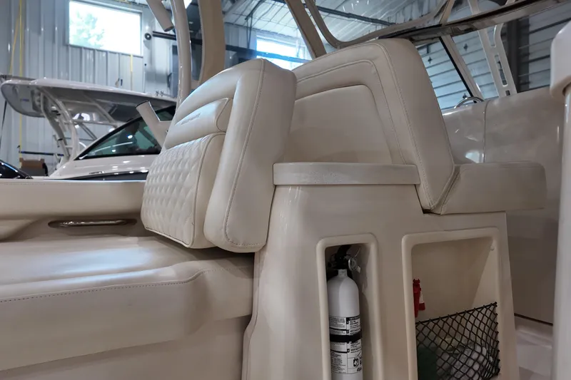 Slide: The Image of 2024 Grady-White Freedom 307 boat on trailer at dealership, Terry's Majestic Marine. - 2