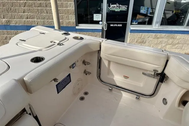 Slide: The Image of 2024 Grady-White Freedom 307 boat interior with seating and cup holders. - 27