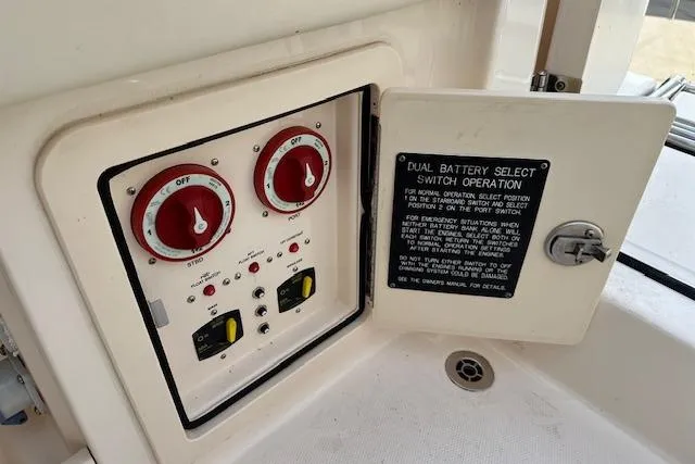 Slide: The Image of 2024 Grady-White Freedom 307 dual battery switch panel with operation instructions. - 30