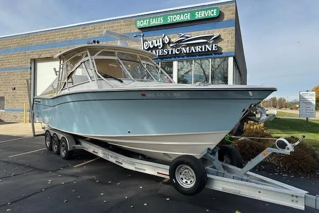 Slide: The Image of 2024 Grady-White Freedom 307 boat on trailer at marine dealership. - 33