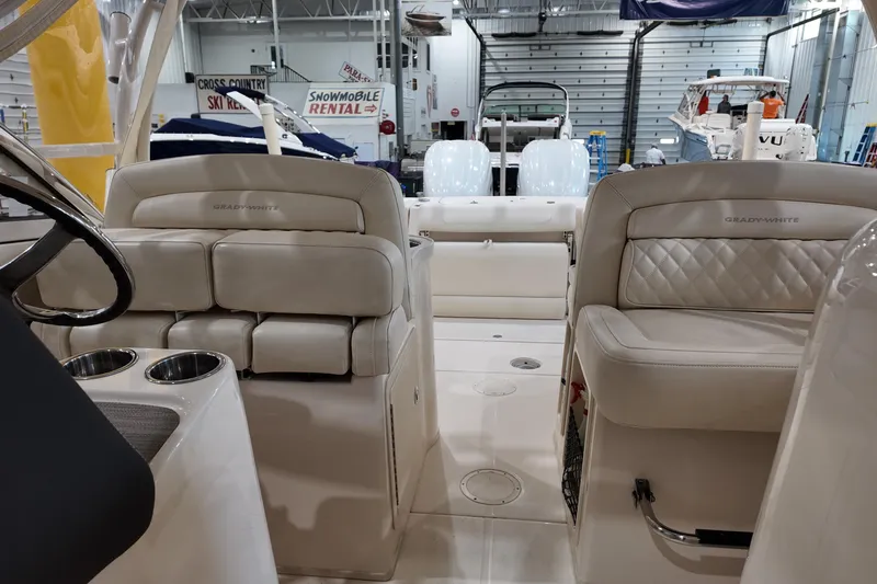 Slide: The Image of 2024 Grady-White Freedom 307 boat interior with blue LED lights and speaker system. - 5