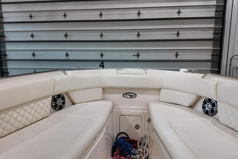 Slide: The Image of 2024 Grady-White Freedom 307 boat interior with sink, storage, and seating area. - 7
