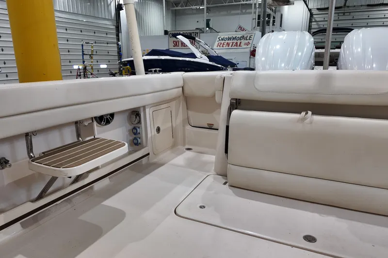 Slide: The Image of Storage compartment with tackle boxes on a 2024 Grady-White Freedom 307 boat. - 8