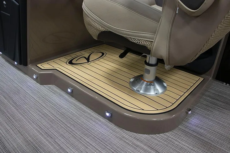 Slide: The Image of 2022 Veranda VP25VLC boat interior with captain's chair and illuminated flooring. - 20