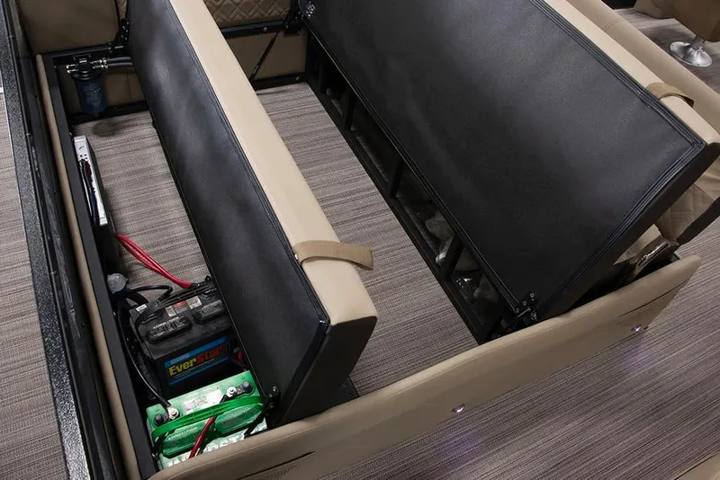 Slide: The Image of Under-seat storage compartment in a 2022 Veranda VP25VLC boat, showing battery and wiring. - 23
