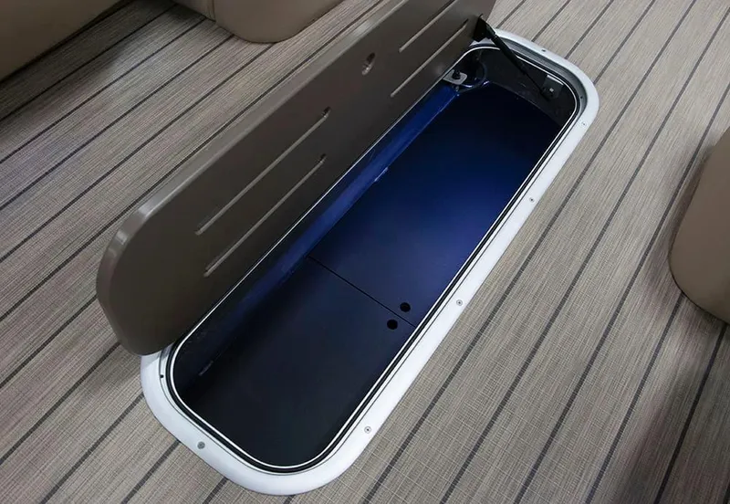 Slide: The Image of Open storage compartment on 2022 Veranda VR25RC boat with striped flooring. - 5