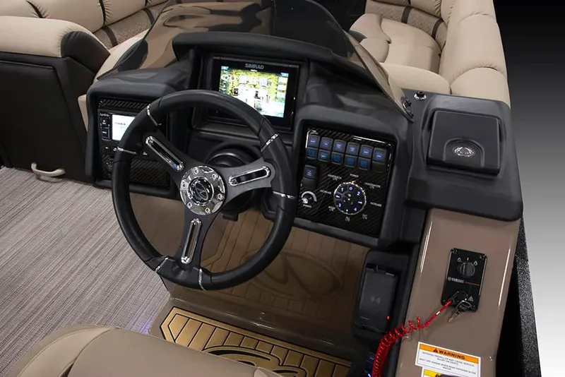 Slide: The Image of 2022 Veranda VP25VLC boat dashboard with steering wheel and control panel. - 3
