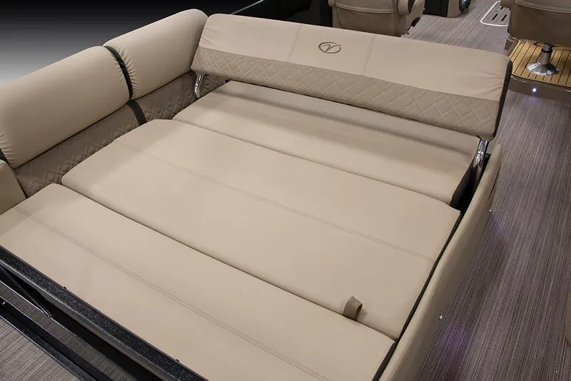 Slide: The Image of 2022 Veranda VP25VLC boat with luxurious beige seating and convertible lounge area. - 7