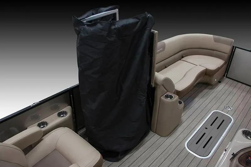 Slide: The Image of 2022 Veranda VR25RC interior with beige seating and black privacy curtain. - 11