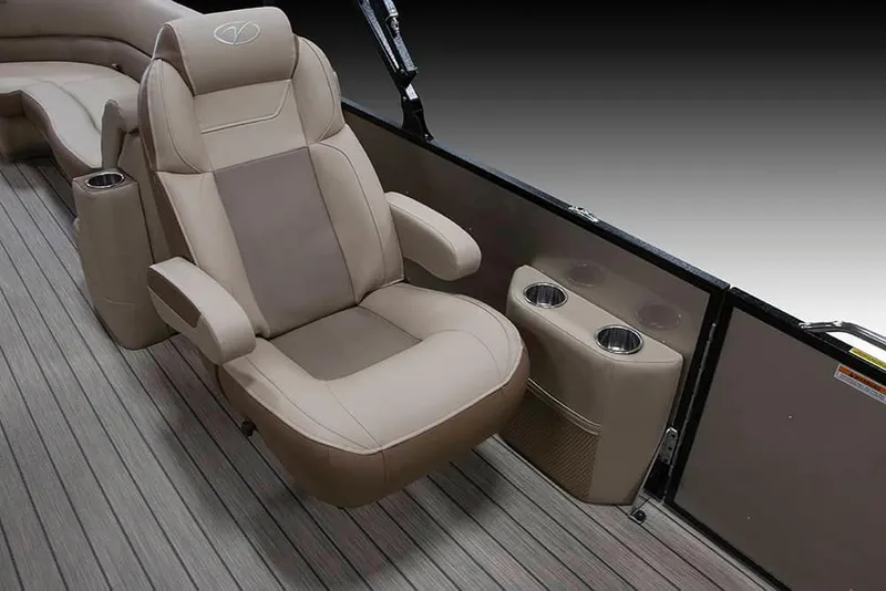 Slide: The Image of 2022 Veranda VR25RC boat interior with beige captain's chair and cup holders. - 3