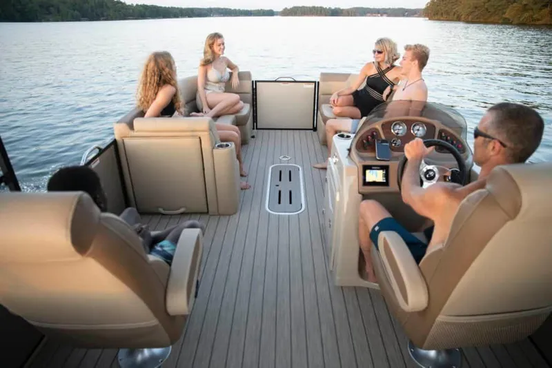 Slide: The Image of People enjoying a ride on a 2022 Veranda VR25RC pontoon boat. - 7