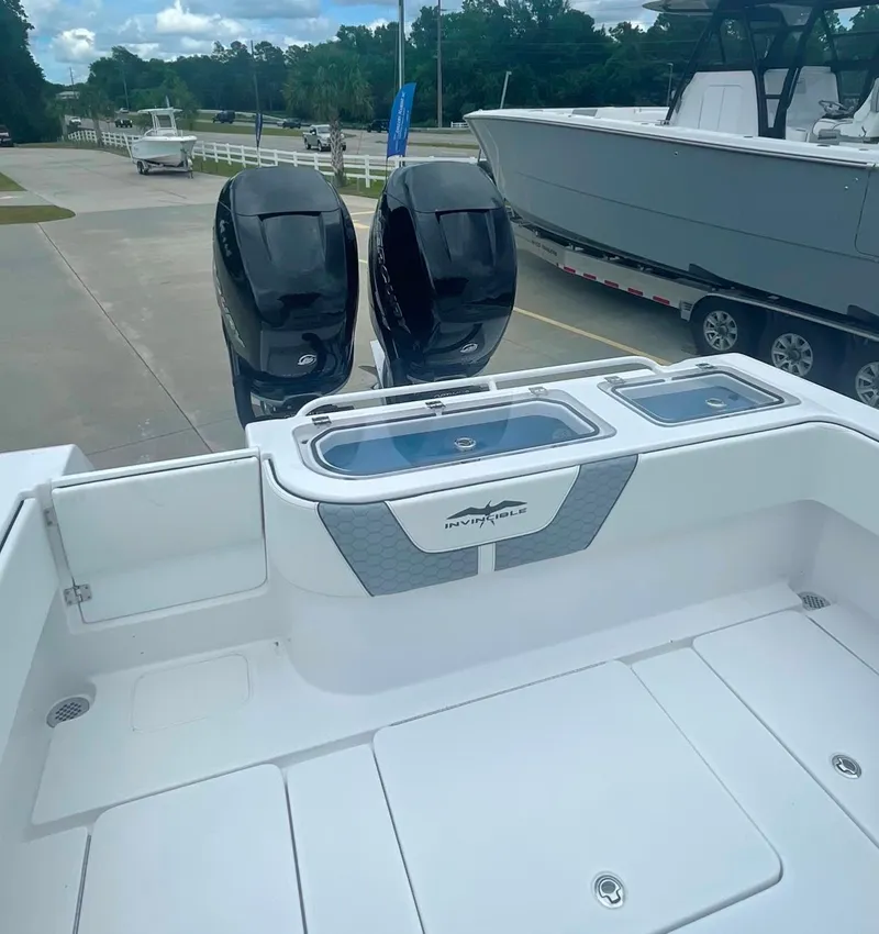 Slide: The Image of 2024 Invincible 33 Open Fisherman boat with dual outboard motors. - 11