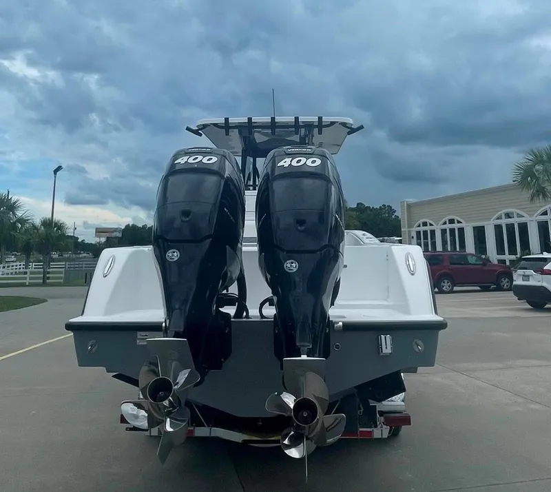 Slide: The Image of 2024 Invincible 33 Open Fisherman with twin 400 HP engines, rear view. - 2