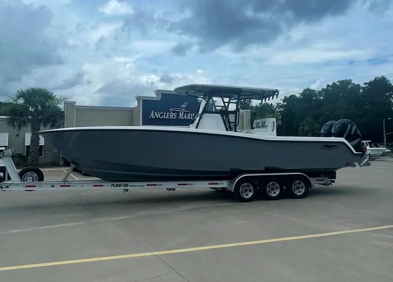 Slide: The Image of 2024 Invincible 33 Open Fisherman boat on a trailer at Angler's Marine. - 0
