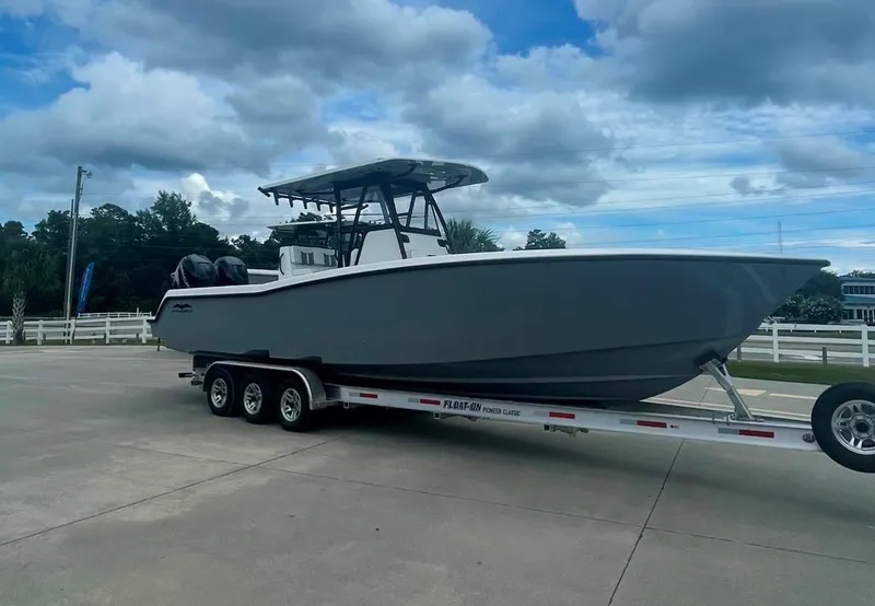 Slide: The Image of 2024 Invincible 33 Open Fisherman boat on a trailer, ready for transport. - 1