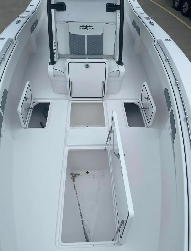 Slide: The Image of 2024 Invincible 33 Open Fisherman boat with open storage compartments. - 4
