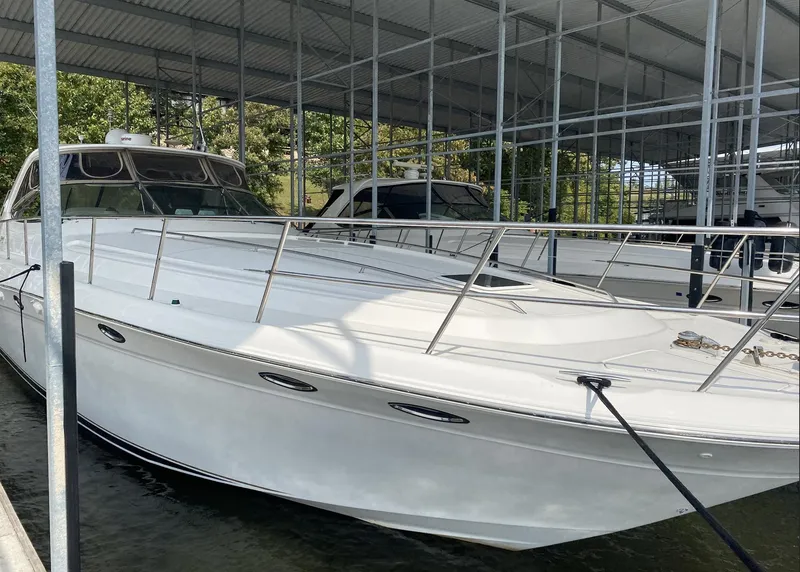 Slide: The Image of 2000 Sea Ray 540 Sundancer yacht docked in a covered marina. - 5
