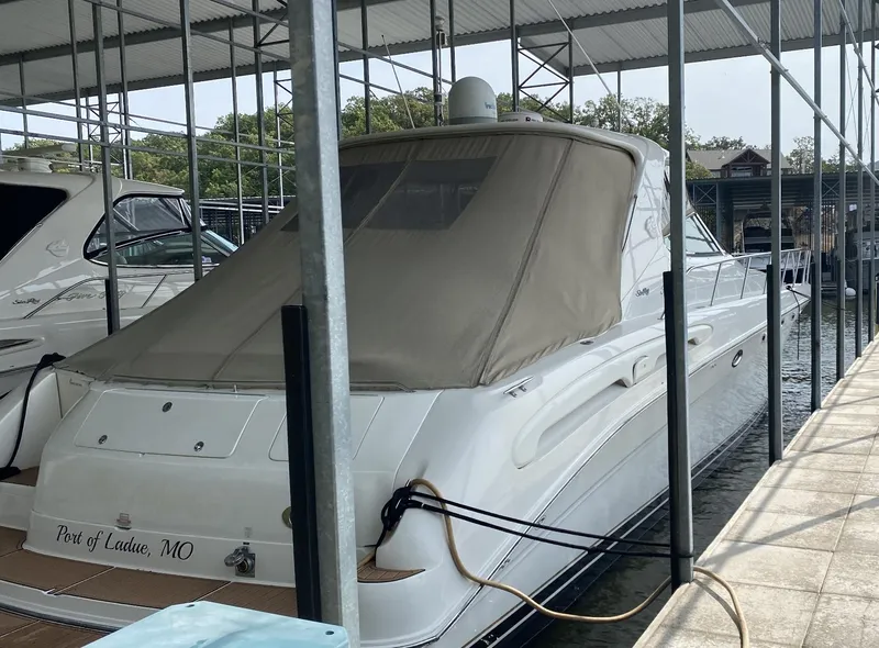 Slide: The Image of 2000 Sea Ray 540 Sundancer docked at marina, rear view. - 6