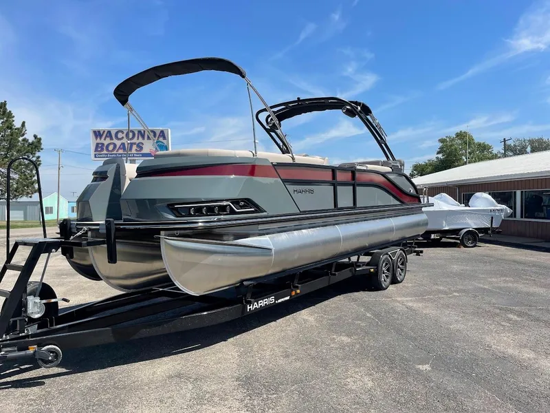 The Image of 2024 Harris 270 Grand Mariner pontoon boat on a trailer at Waconda Boats dealership. - 1
