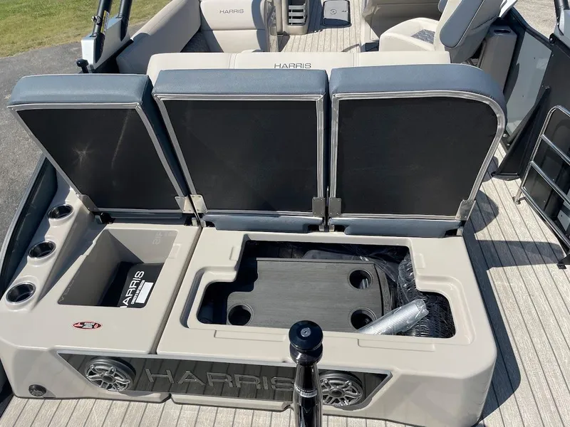 Slide: The Image of 2024 Harris 270 Grand Mariner boat interior with open storage compartments. - 10