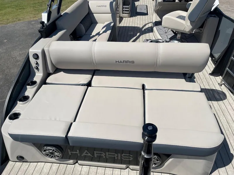 Slide: The Image of 2024 Harris 270 Grand Mariner boat with luxurious seating and cup holders. - 12