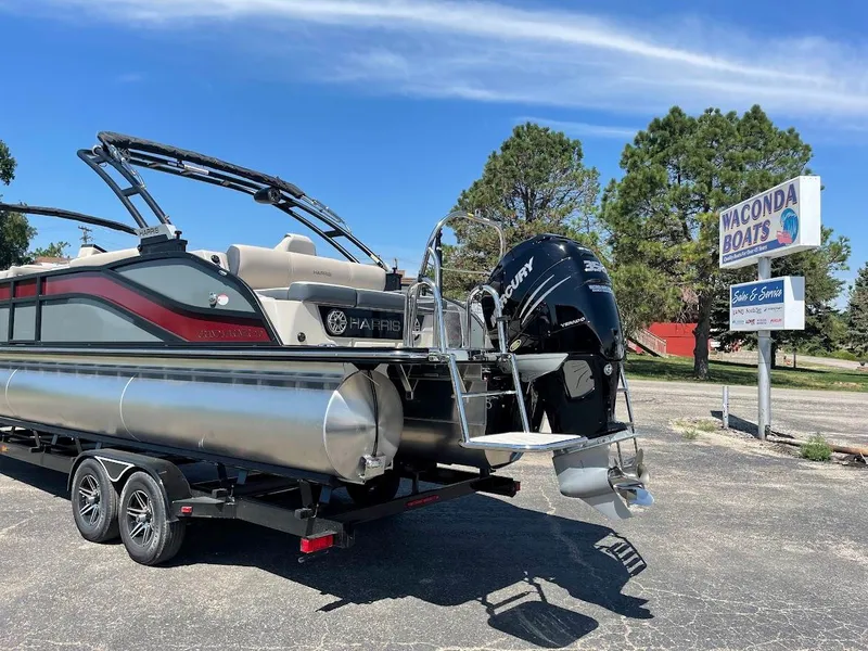 Slide: The Image of 2024 Harris 270 Grand Mariner pontoon boat on trailer at Waconda Boats dealership. - 16
