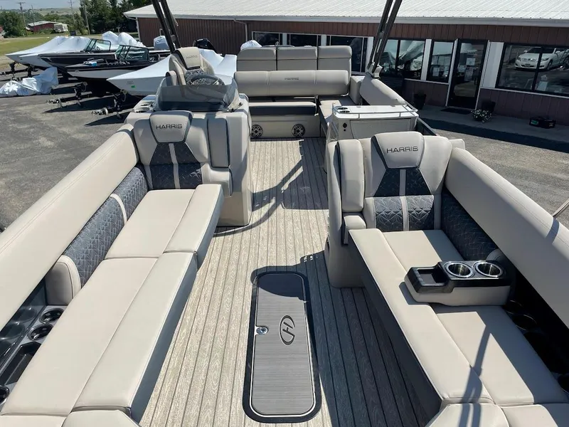 Slide: The Image of 2024 Harris 270 Grand Mariner pontoon boat with spacious seating and modern design. - 3