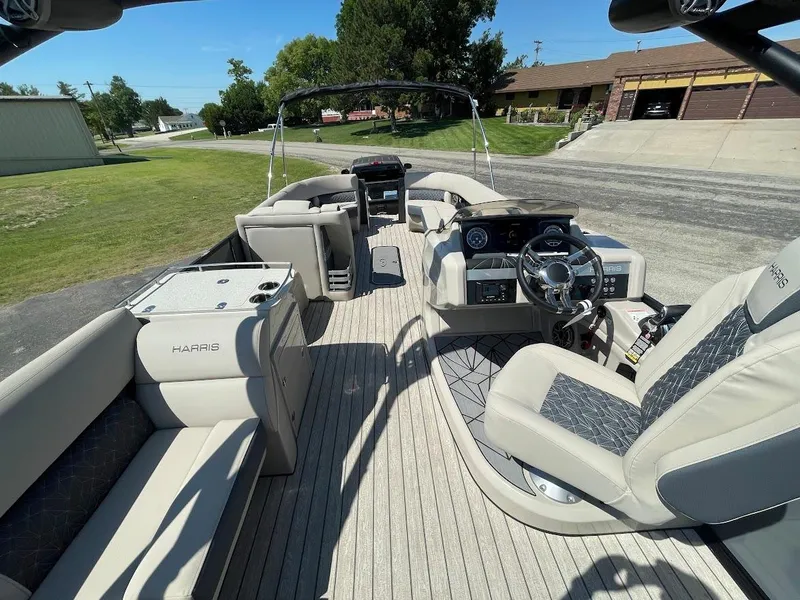 Slide: The Image of 2024 Harris 270 Grand Mariner boat interior with luxurious seating and modern dashboard. - 5