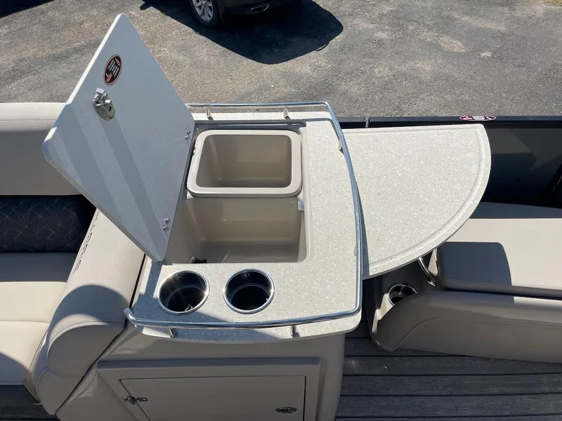 Slide: The Image of 2024 Harris 270 Grand Mariner boat with built-in sink and cup holders. - 7