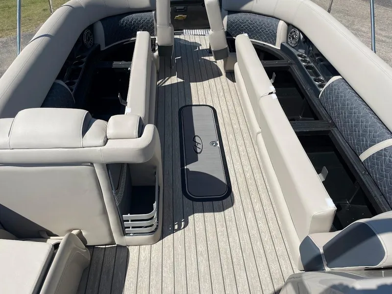 Slide: The Image of 2024 Harris 270 Grand Mariner boat interior with spacious seating and storage compartments. - 15