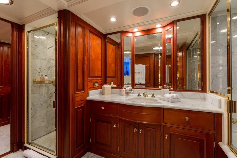 Slide: The Image of Luxurious bathroom on 1997 Palmer Johnson motor yacht with wood cabinetry and marble accents. - 10
