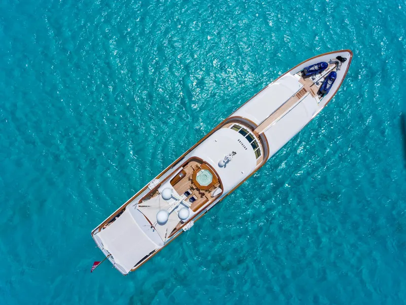 Slide: The Image of Aerial view of 1997 Palmer Johnson motor yacht on turquoise water. - 20