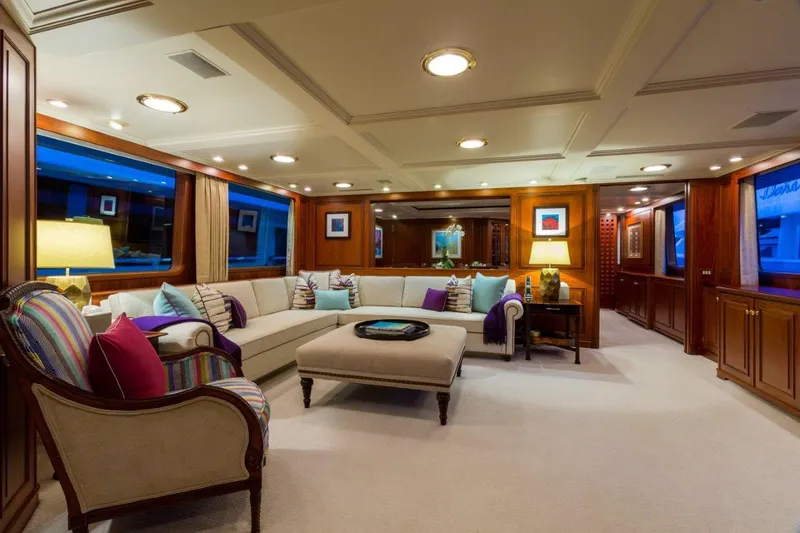 Slide: The Image of Luxurious interior of a 1997 Palmer Johnson motor yacht with elegant seating and ambient lighting. - 4