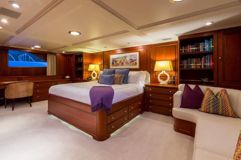 Slide: The Image of Luxurious 1997 Palmer Johnson motor yacht bedroom with elegant wood furnishings and cozy decor. - 7