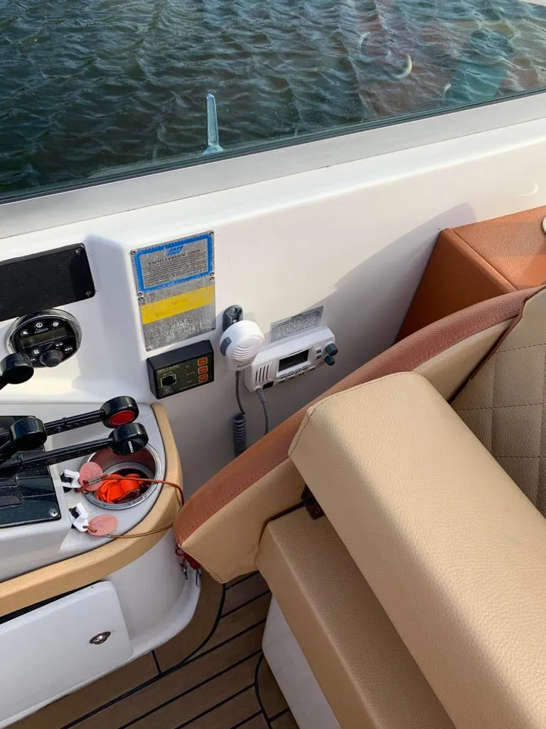 Slide: The Image of 1999 Formula 280 Bowrider boat cockpit with control panel and seating. - 16