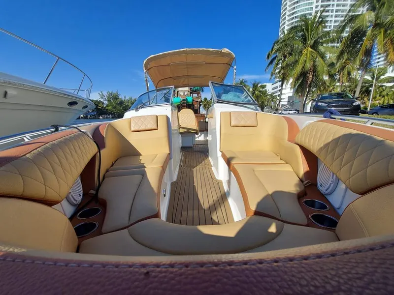 Slide: The Image of 1999 Formula 280 Bowrider with luxurious tan seating and open deck layout. - 33