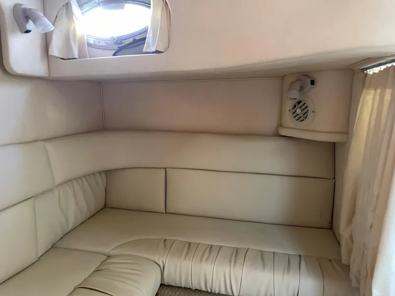 Slide: The Image of Interior cabin of a 2002 Sea Ray 340 Sundancer with beige seating. - 14